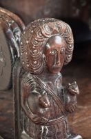 Carved figure on chair arm