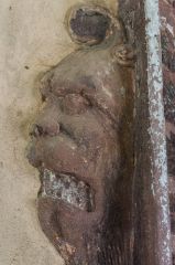 Grotesque corbel head carving