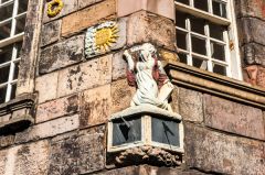 Carved and painted sundial, house exterior