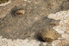 Depressions in the Cup Stone