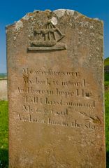 Grave stone with a sailing ship