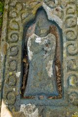 Carved figure of a priest