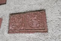 17th century carved stone in church wall