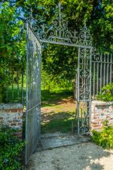 A wrought iron garden gateway
