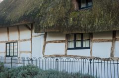 Thatched, timber frame cottage opposite the church