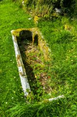 A stone coffin set into the ground