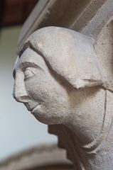 Carved head, nave pillar