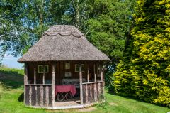 A thatched summer house in the garden