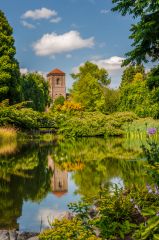 Little Malvern Priory reflected in a garden pool
