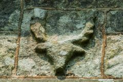 Carved stag head on the exterior wall