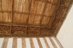 The ornately carved 15th century wooden cornice