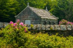 The mausoleum and stone enclosure wall