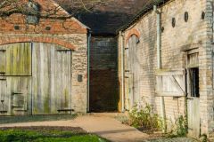 Farm buildings beside the house