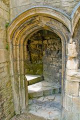 Archway to a set of spiral stairs
