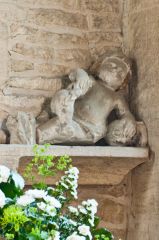 Carved figure, east wall