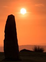 Sunset over a standing stone
