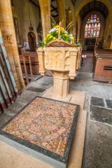 The 15th century font and 13th century tiles
