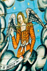 An angel holding a banner