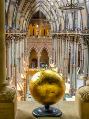 A gilded globe on the gallery level