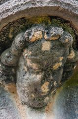 Carved head on the night stairs