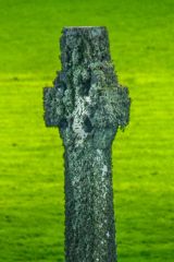 A standing cross beside the burial ground