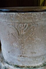 Early English font with fleur-de-lys carving