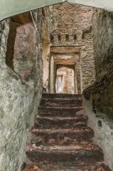 A very worn staircase to from the cellars