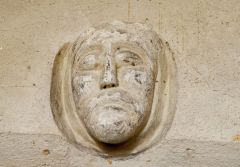 Medieval carved head, north west nave wall