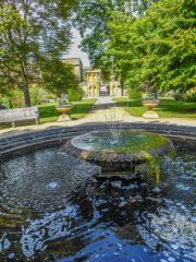 A shaded fountain and garden path