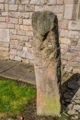 A standing stone by the east gable end
