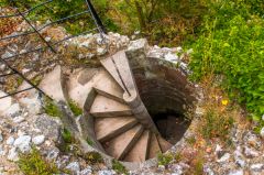 Spiral stair to basement storage chambers