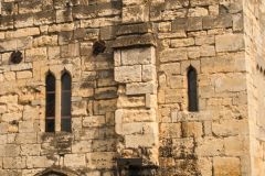 Narrow lancet windows on the first floor