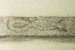 String course carving of a serpent