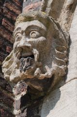 Queens' College, Carved head on a doorway arch
