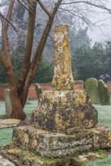 A medieval cross shaft in the churchyard