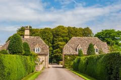 The holly avenue and gatehouse entrance to Rodmarton Manor