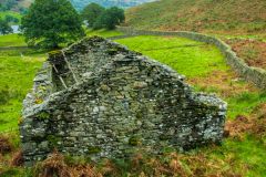 A ruined cottage by the lakeshore