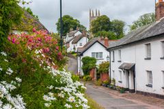 St Andrew's church tower just visible over the nearby cottages