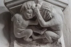 Children pulling hair column capital