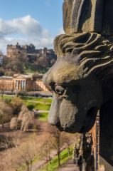 Carved dog head with Edinburgh Castle beyond