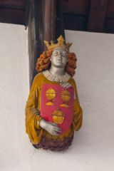 A painted corbel head