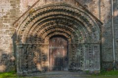The Norman west door of the Priory church