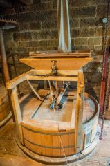 The grain hopper and grinding wheel