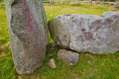Recumbent stone propped up