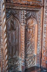 Carved panel on the screen base