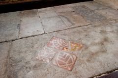 Medieval floor tiles by the altar