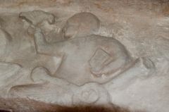 Tarrant Rushton, St Mary's Church, Carved figure on the marble lintel