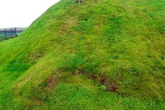 The earthern exterior of the cairn