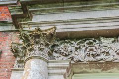 Corinthian column flanking the doorway