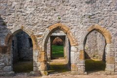 Stone screen across the northeast end of the building